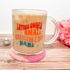 Sip like a boss babe from our 'Latina Owned Small Business Babe' 15oz mug! This clear glass beauty is your daily reminder that you're not just sipping, you're supporting. The sublimated design may appear light on the glass but watch it come to life when you add your favorite brew!