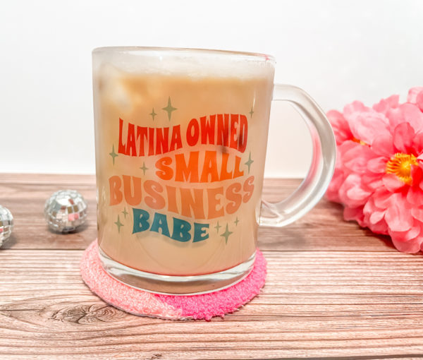 Sip like a boss babe from our 'Latina Owned Small Business Babe' 15oz mug! This clear glass beauty is your daily reminder that you're not just sipping, you're supporting. The sublimated design may appear light on the glass but watch it come to life when you add your favorite brew!