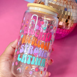 Sip in style with our 16oz glass beer can cup featuring "Educated Orgullosa Strong Latina" in a double-sided UV DTF design. Includes bamboo lid and straw. Perfect for your favorite drinks, this cup is a must-have for any proud Latina.