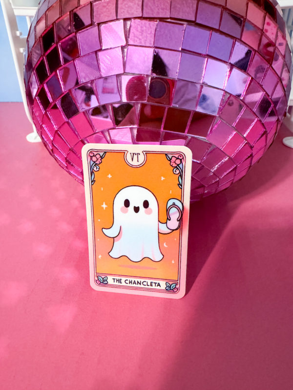 Unleash some spooky vibes with our Tarot-Inspired Ghost Holding a Chancleta Sticker!