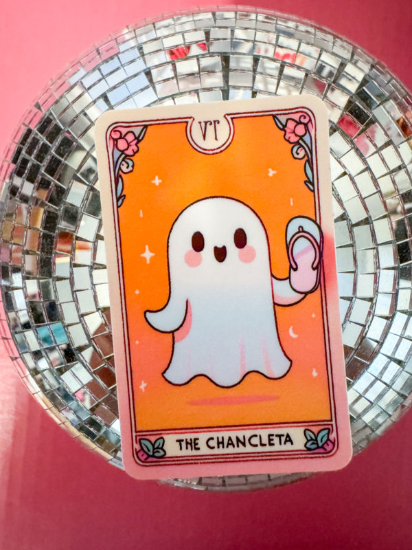 Unleash some spooky vibes with our Tarot-Inspired Ghost Holding a Chancleta Sticker!