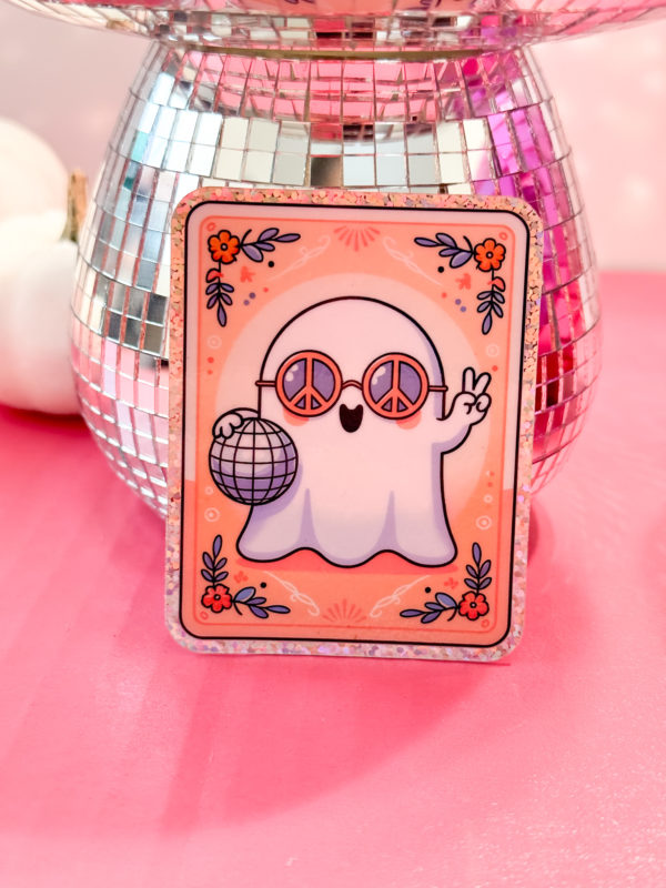 A holographic ghost in groovy sunglasses, holding a disco ball with the peace sign up in a tarot card style