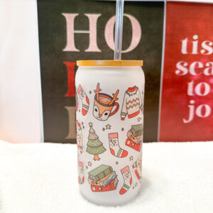 Sip your favorite holiday beverages in style with this 16oz frosted glass can featuring a cozy and festive design! Adorned with a sweater, Christmas tree, books, stockings, and reindeer, this cup is perfect for anyone who loves the warm and fuzzy vibes of the holiday season.