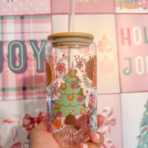 Add a touch of retro flair to your holiday drinkware collection with this 16oz Groovy Christmas glass can! Featuring a double-sided UV DTF design, this unique tumbler brings together a festive disco ball, a Christmas tree adorned with smiley-face string lights, and the playful words "Ho Ho Ho" for a cheerful vibe.